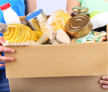 A cardboard box of canned food